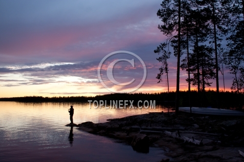 Fisherman silhouette on the beach at colorful sunset 04