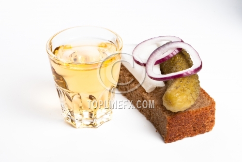 Pepper-brandy in small glass with black bread, pickled, onion and bit of lard